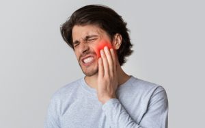 man with toothache